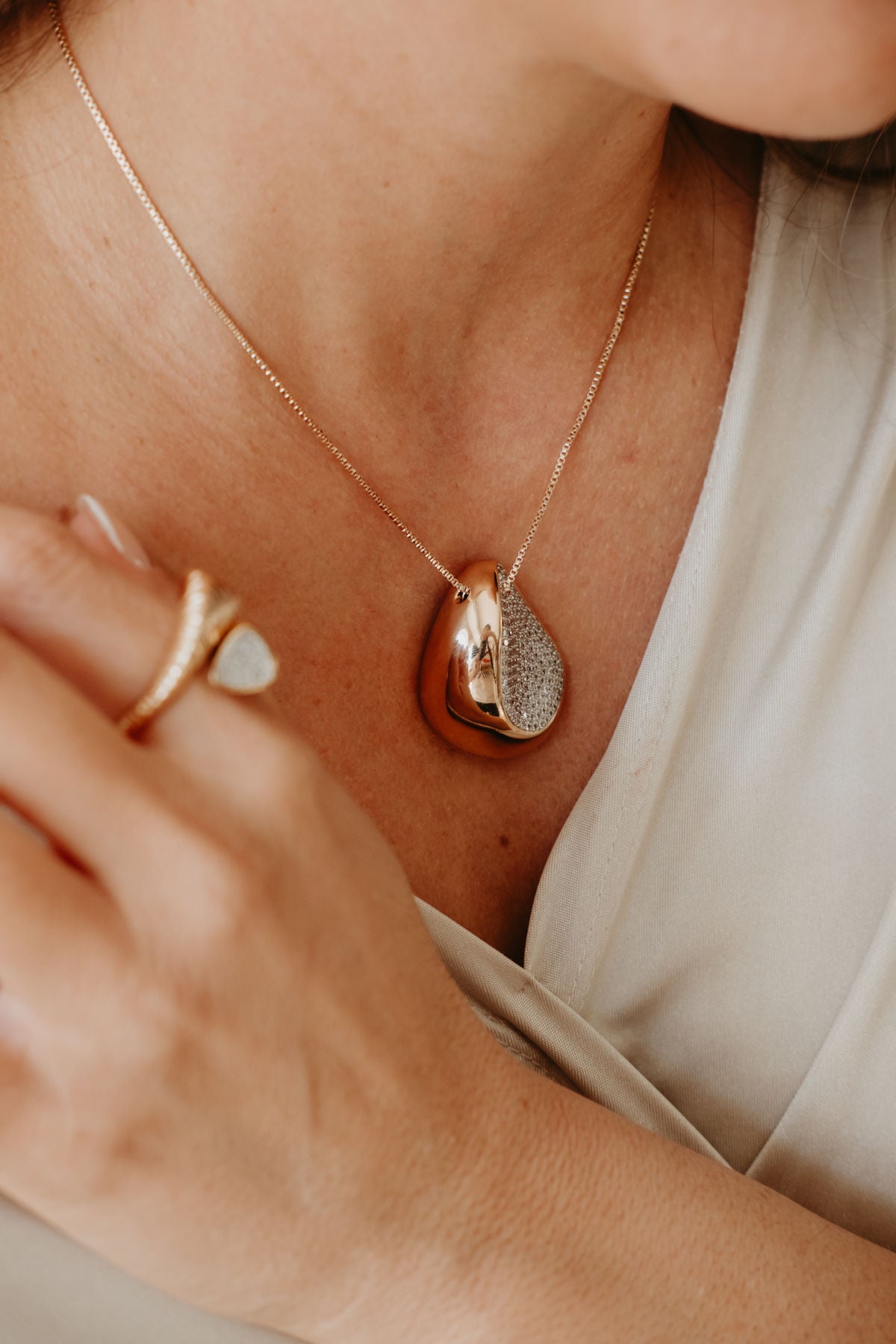 18K gold plated necklace with sculptural teardrop pendant and sparkling pavé zirconia