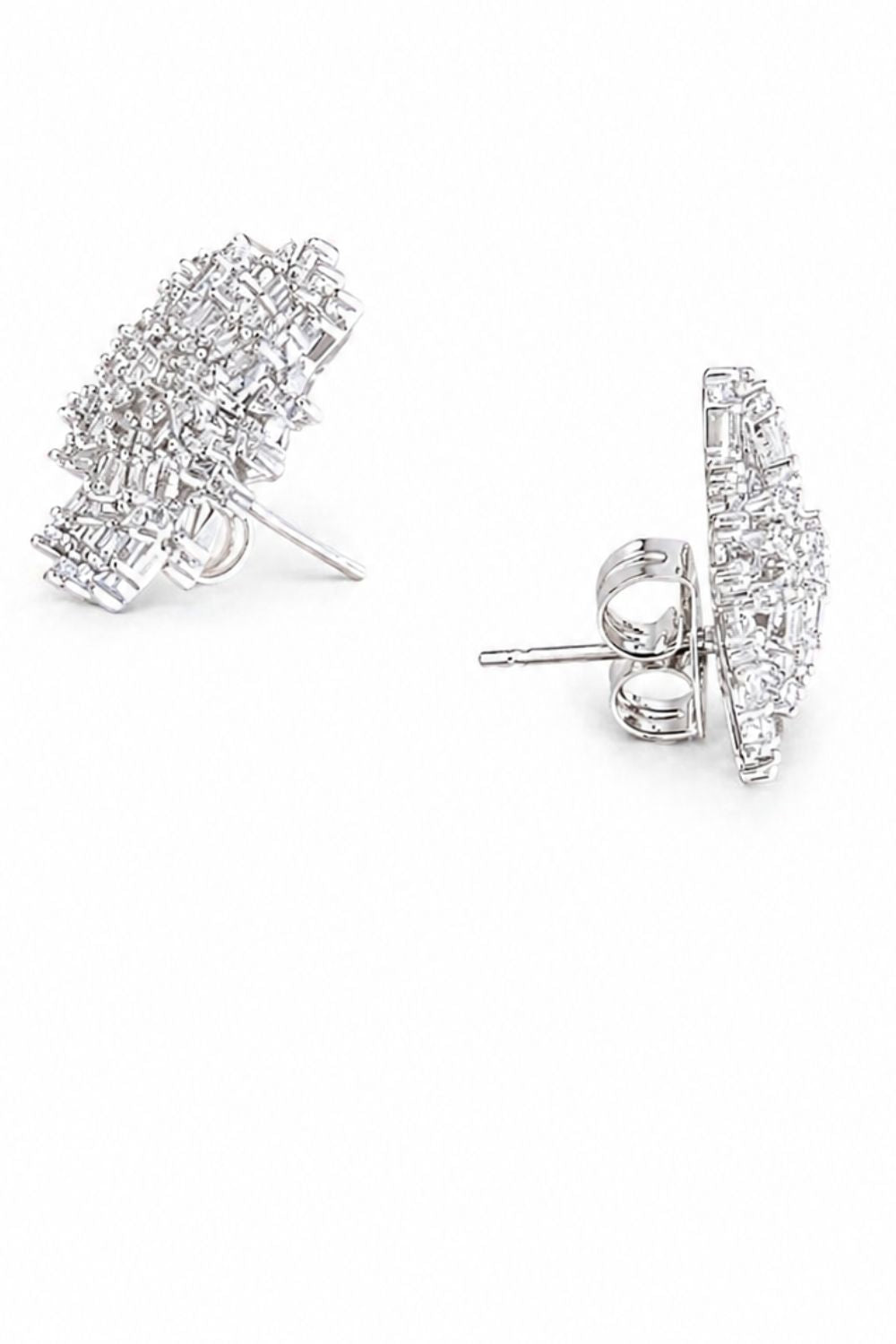 silver starburst earrings with round and baguette cut zirconia sparkling luxury jewelry detail design