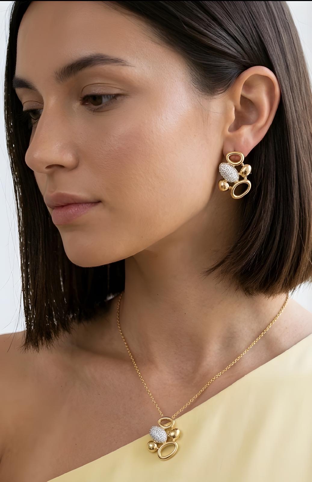 Gold pendant necklace for women featuring polished geometric shapes and brilliant zirconia detailing