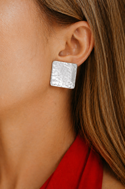 rhodium plated textured stud earrings styled for women elegant modern statement jewelry minimal luxury look