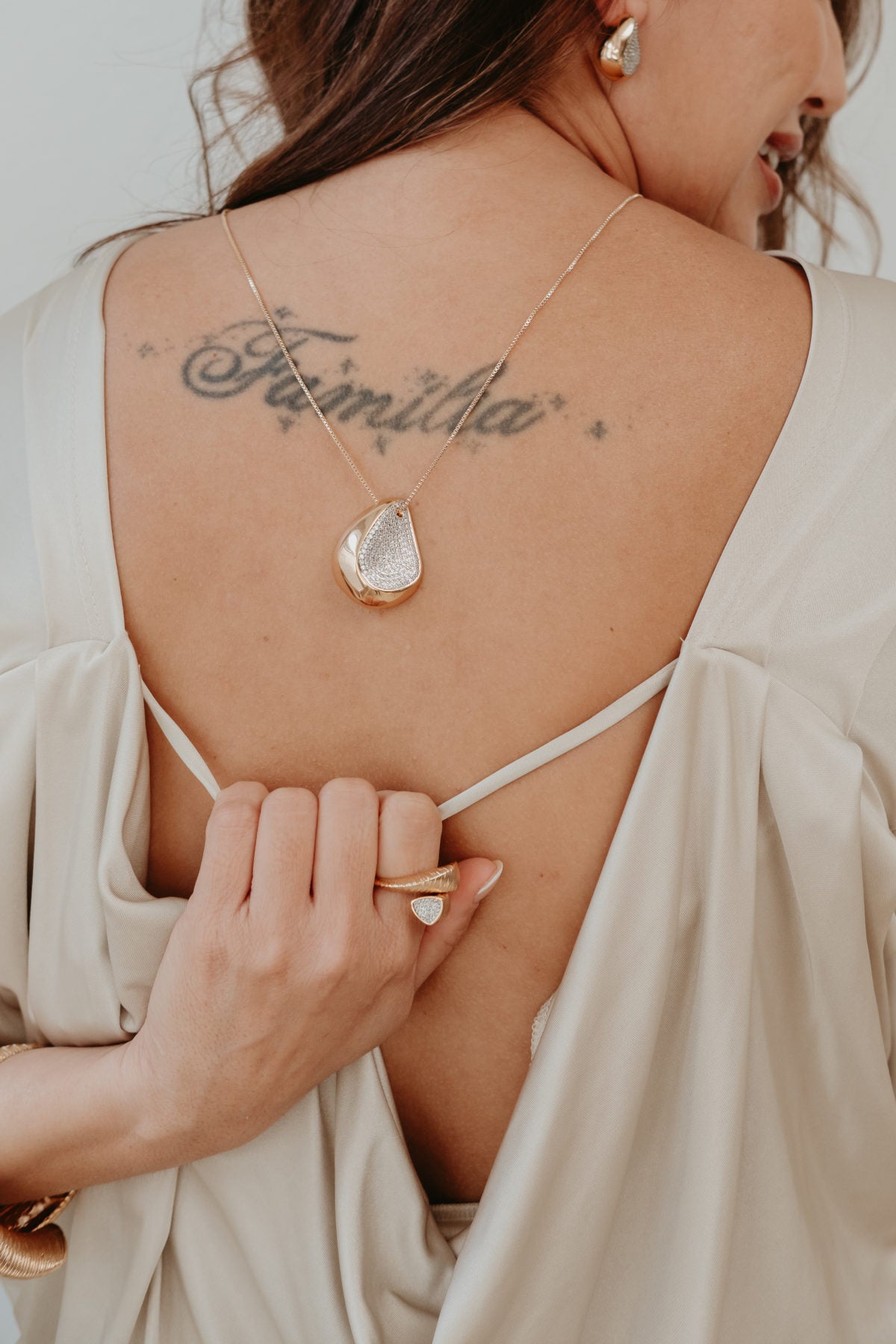 18k gold plated chain necklace with dimensional teardrop pendant and light catching pavé zirconia accent