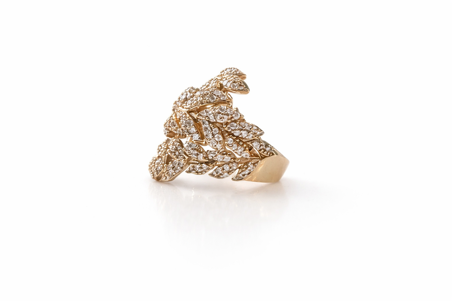 gold leaf design ring with pavé zirconia stones intricate sculptural luxury jewelry detail