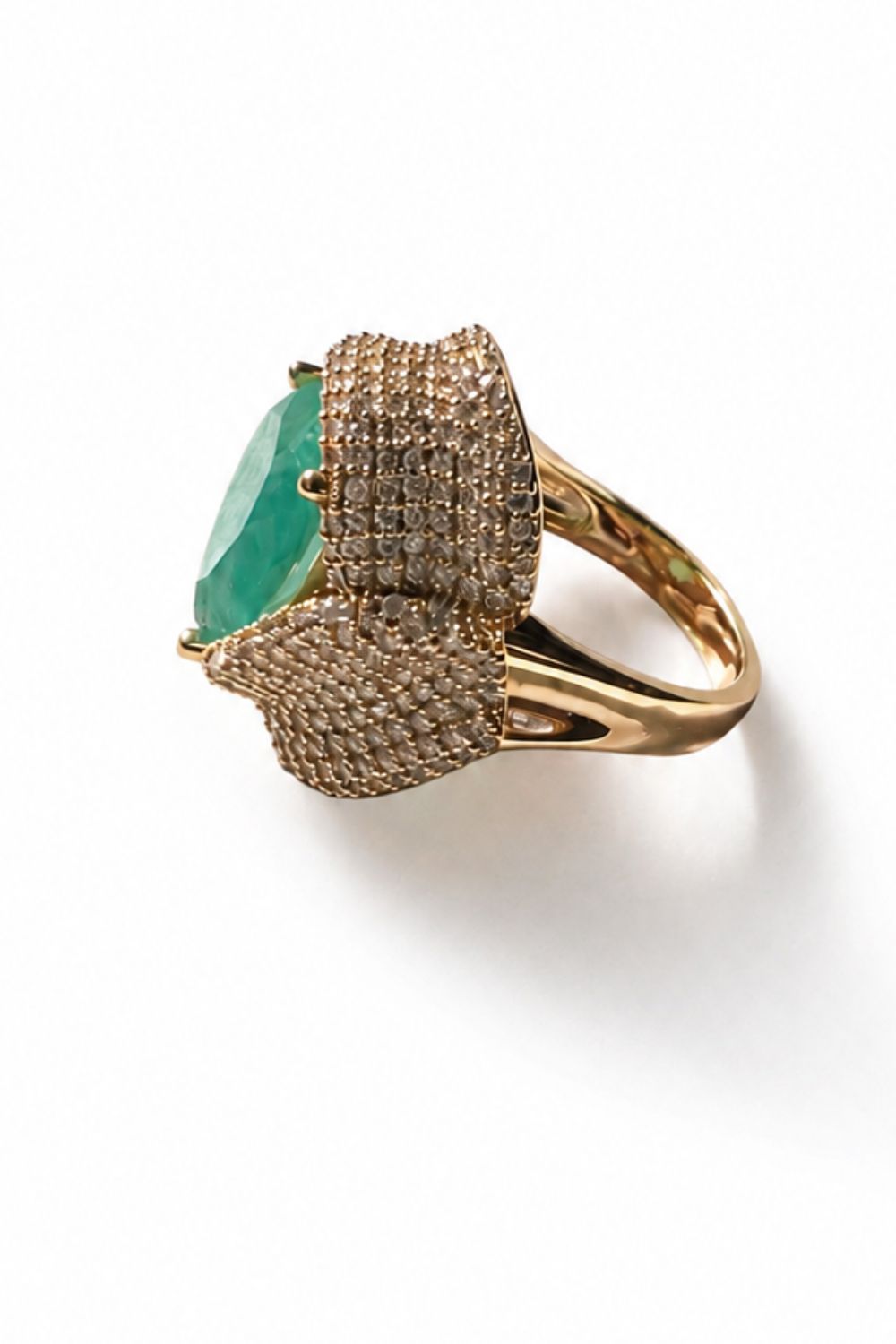 sculptural gold statement ring with tourmaline center and layered zirconia wrap design