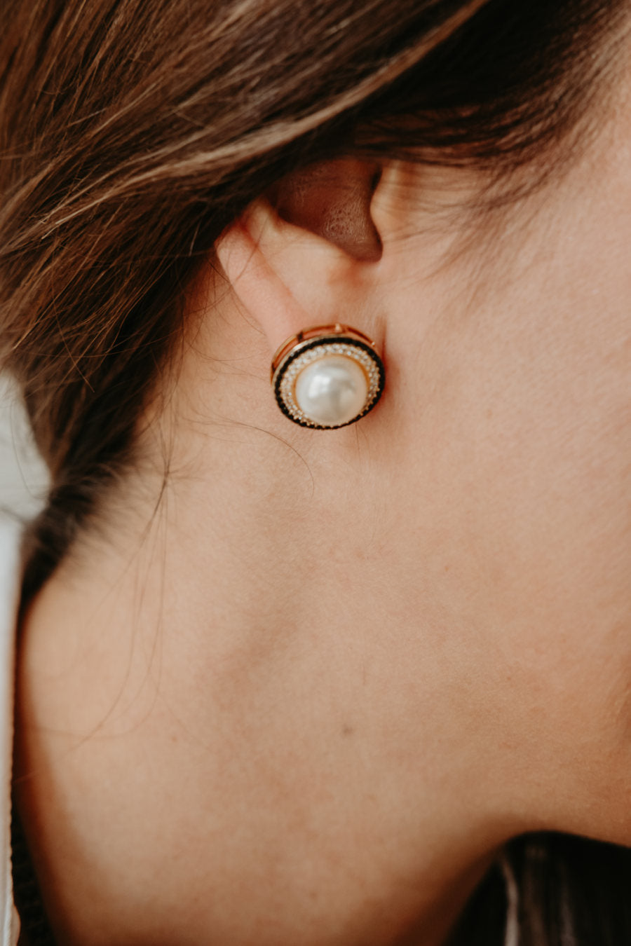 gold statement earrings featuring black zirconia pavé and elegant white faux pearls