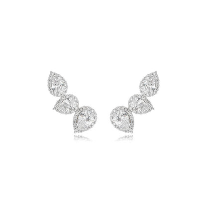 Clear zirconia statement earrings featuring graduated pear shaped stones in an elegant rhodium ear climber design