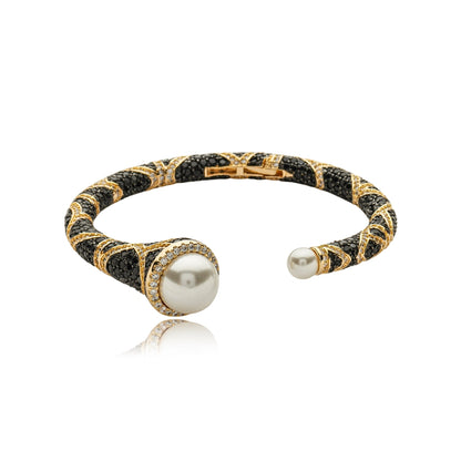 Luxury gold statement bracelet for women with luminous faux pearls and sparkling black and clear zirconia