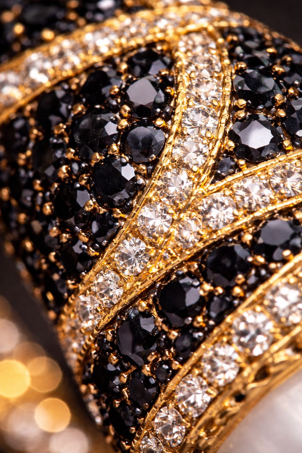 Close up of Le Vie Di Roma bracelet showing polished gold, faux pearls and handset zirconia detailing