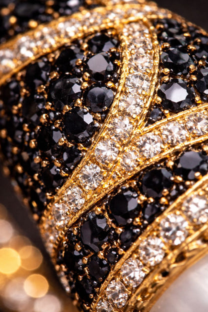 Close up of Le Vie Di Roma bracelet showing polished gold, faux pearls and handset zirconia detailing