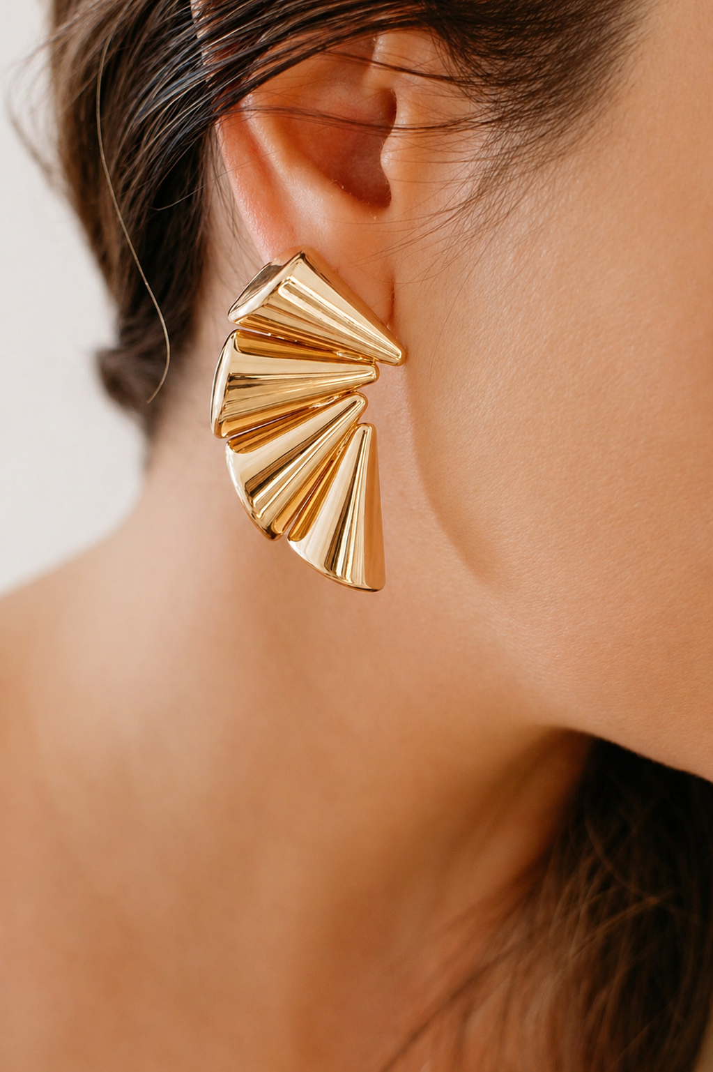 gold crescent earrings styled for women elegant modern statement jewelry day to evening look