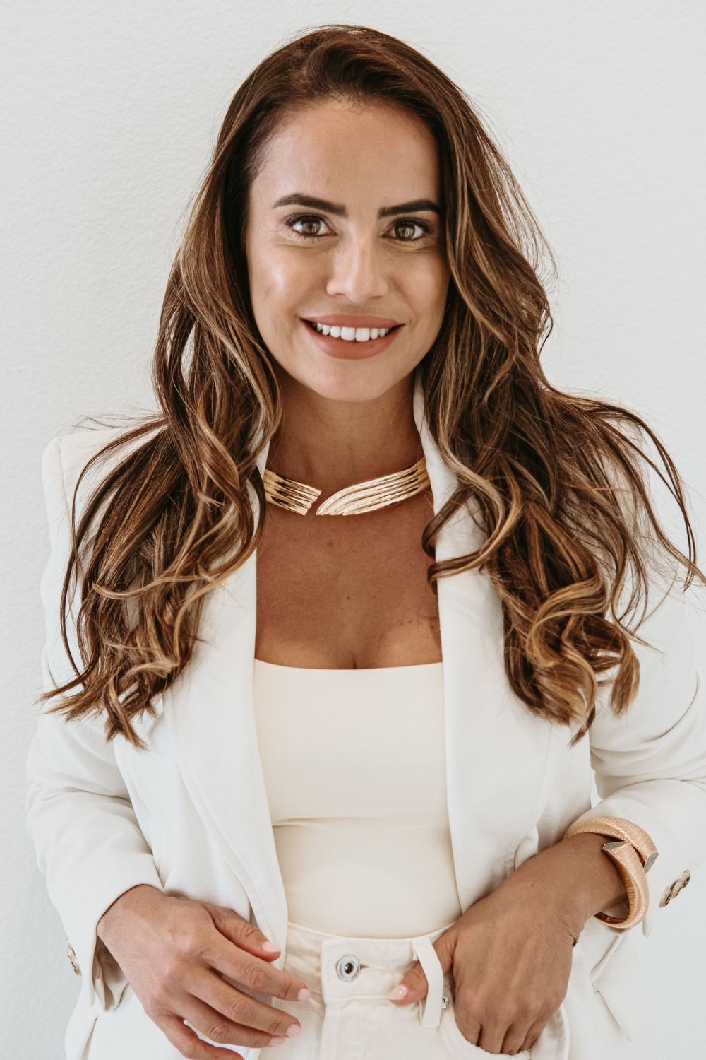 gold statement choker necklace styled for professional women elegant modern luxury jewelry look