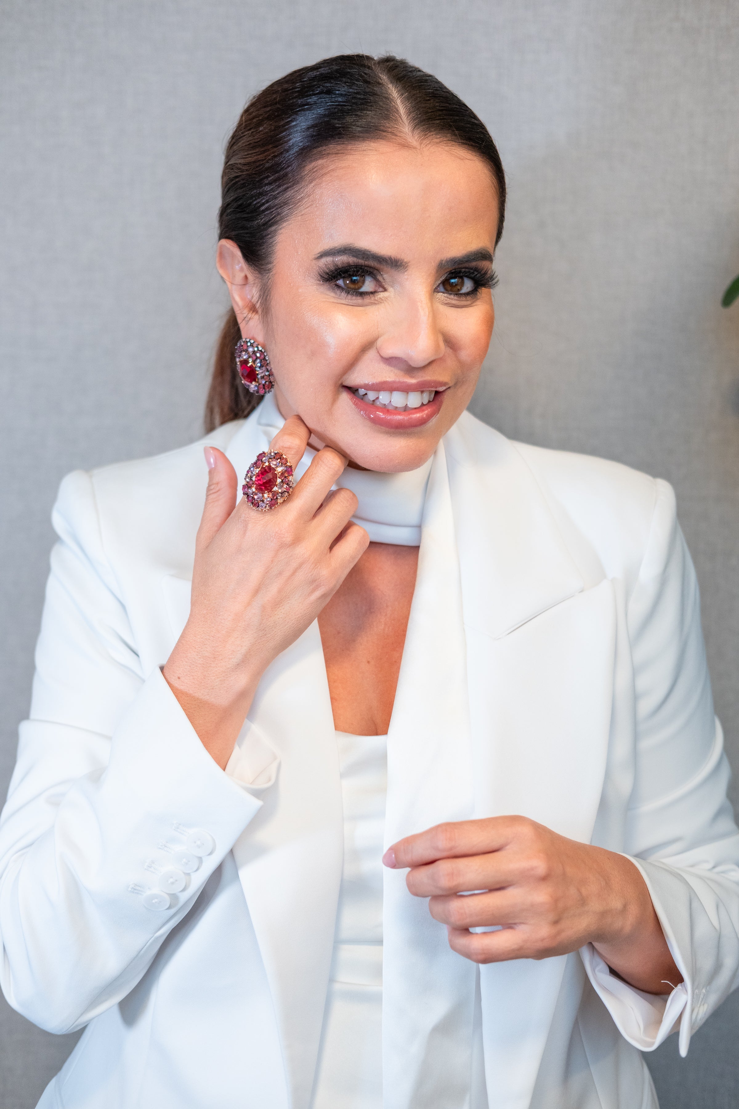 luxury red gemstone ring worn by woman high fashion statement jewelry modern glamorous styling