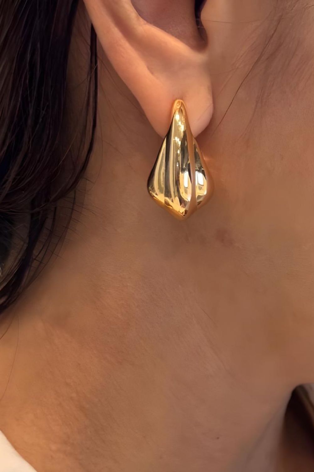 sculptural gold drop earrings layered teardrop shape bold modern statement jewelry