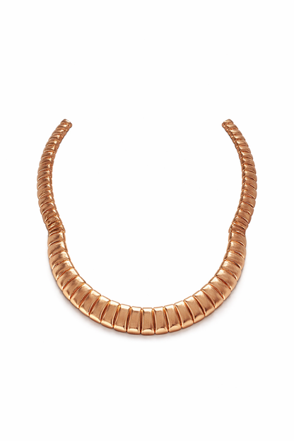 gold choker necklace with downward groove texture high polish sculptural luxury jewelry detail