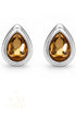 Citrine Zirconia statement earrings with golden amber teardrop stones framed in polished White Rhodium