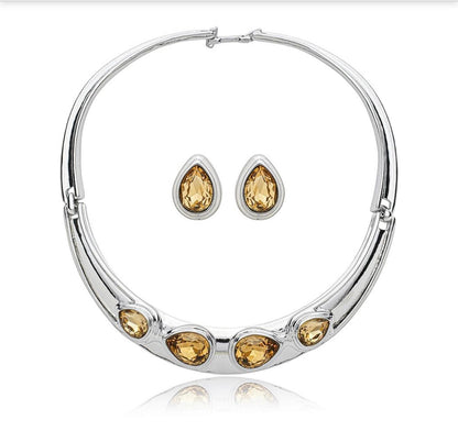 White Rhodium teardrop earrings featuring faceted amber hued Citrine Zirconia stones