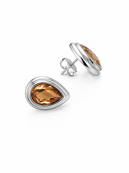 Luxury White Rhodium earrings with warm amber teardrop zirconia stones and sculptural statement design