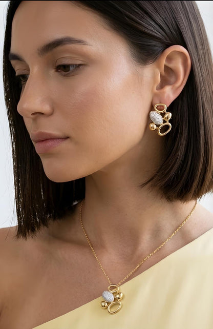 Gold pendant necklace for women featuring polished geometric shapes and brilliant zirconia detailing
