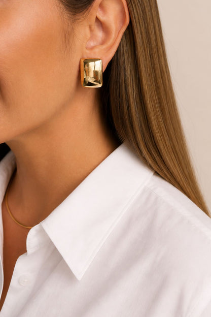 architectural gold stud earrings soft rectangular frame bold modern statement jewelry